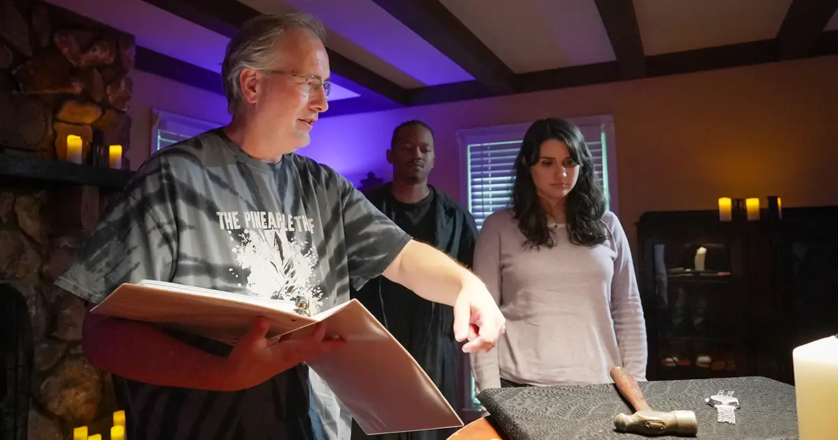 Peacock directs actors on set