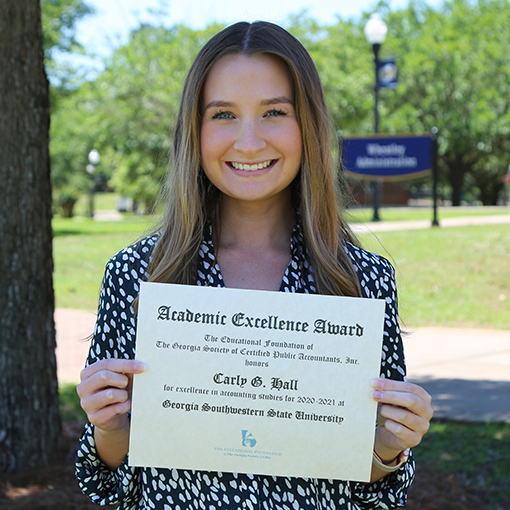 Carly Hall with award