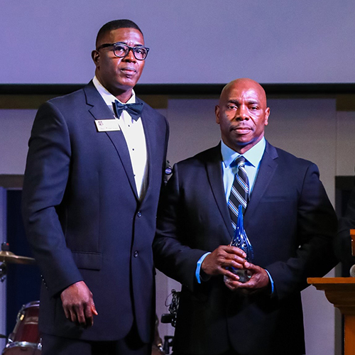 Nate Milledge and Mike Lewis with award