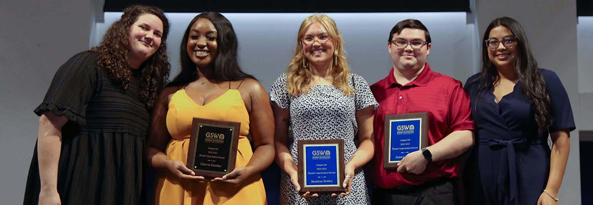 Executive Assistant to the Vice President for Student Engagement & Success Brooke Tome (far left) and Coordinator of Student Activities Yaqueline Torres (far right) present Thunder Camp Student Directors (left to right) Chavis Dunbar, Madison Hobby, and Jamey Fowler.
