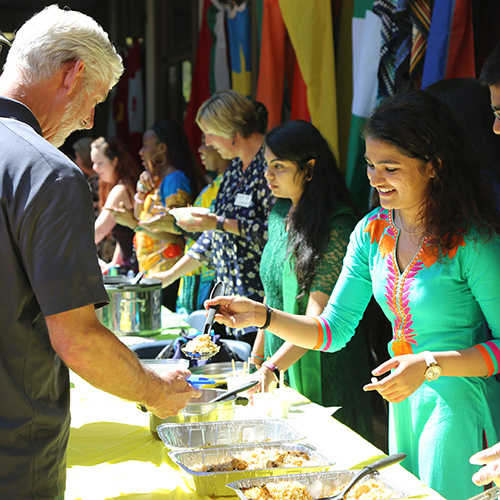 woman serves food to man