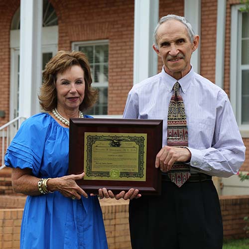 Dr. Yemelyanov holds his patent award with Dean Cheokas