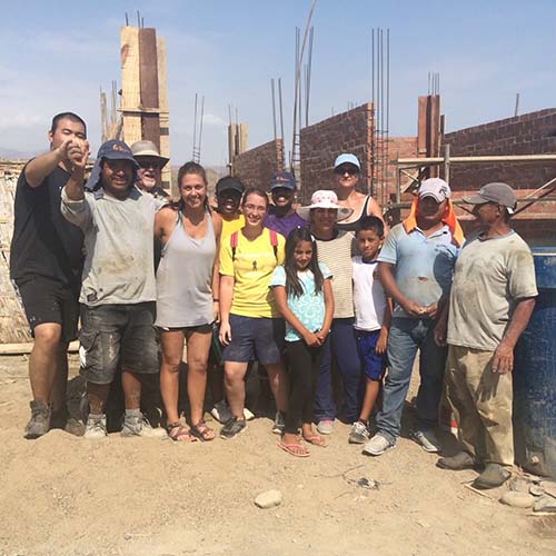 students visit with locals in Peru