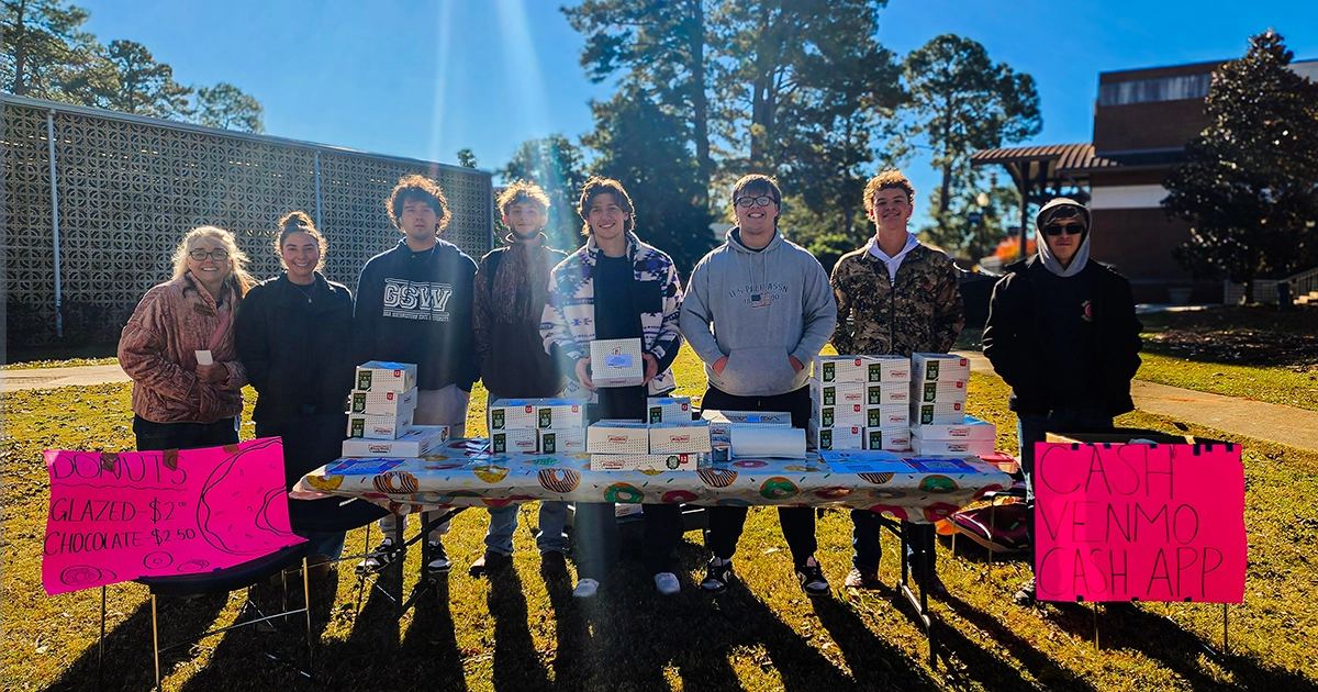 Business Leadership Perspectives students selling donuts