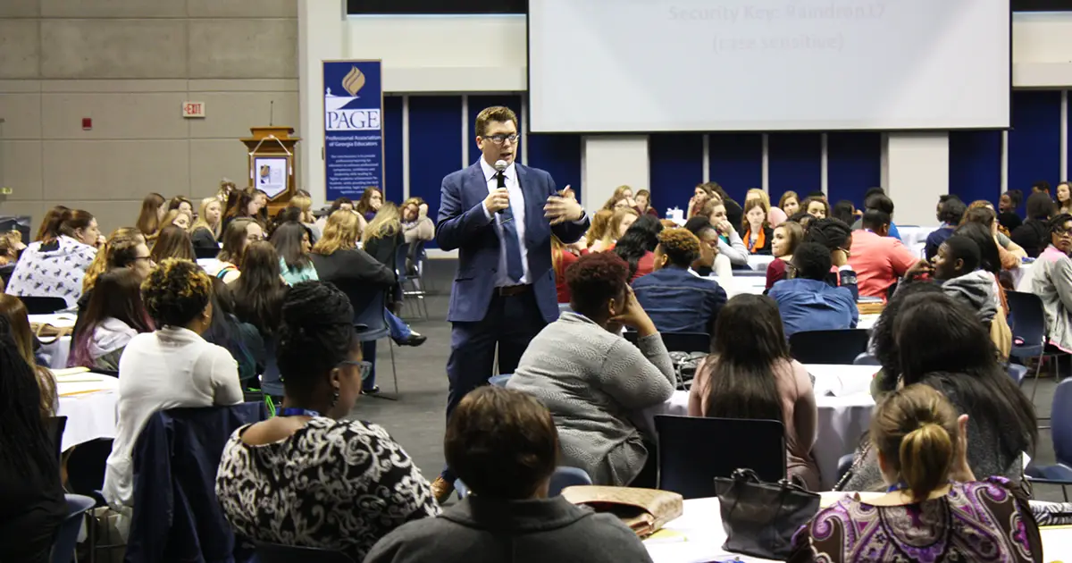 man speaks to students