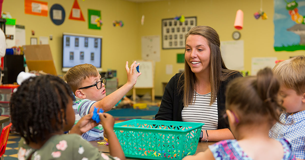 student teacher in classroom with Pre-K children