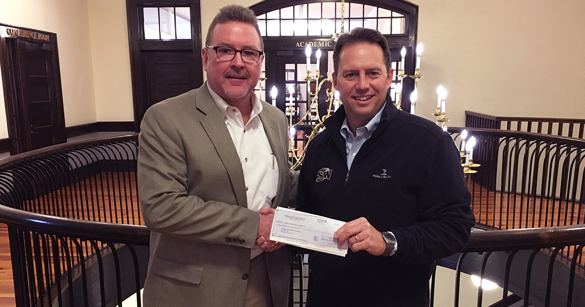 President Weaver accepts check from Georgia Power rep