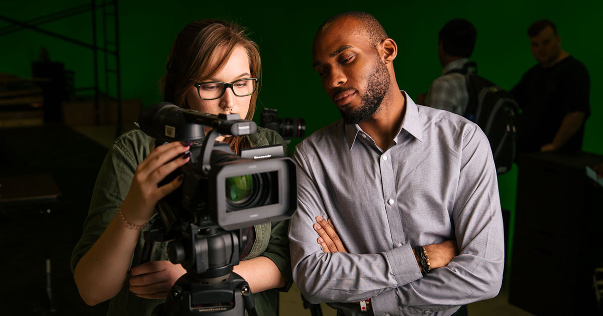 students working with camera