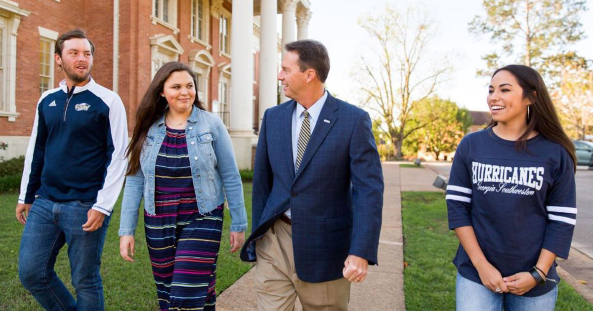 President Weaver walking with students