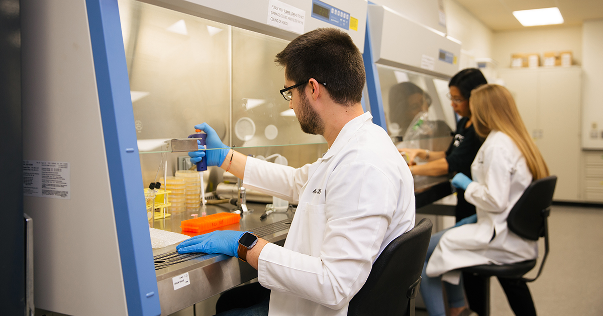 student working in science lab