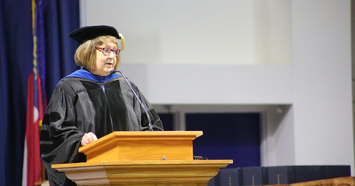 Dr. Liz Wilson speaking at graduation