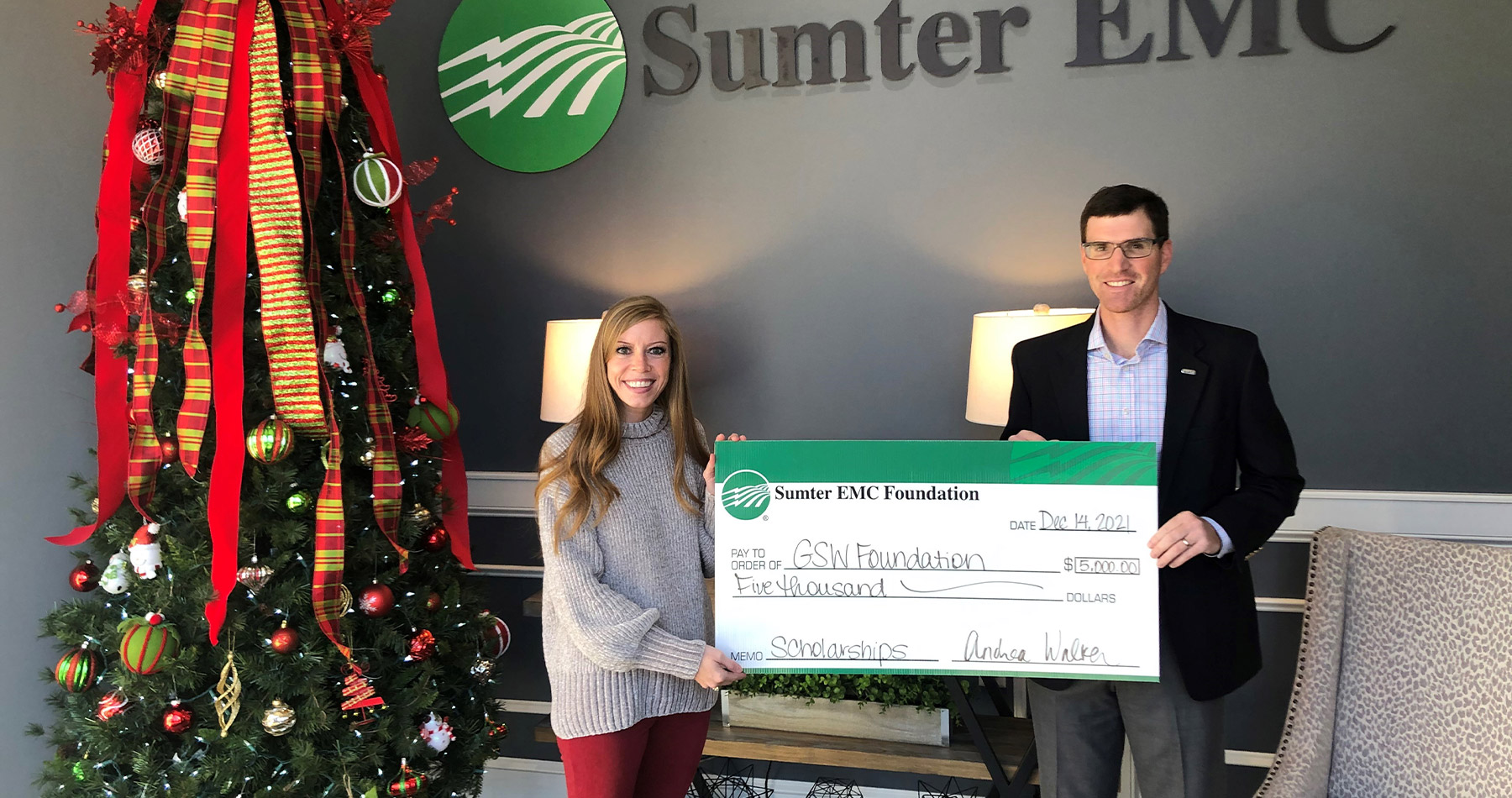 Andrea Walker, Sumter EMC Foundation Chairman, presents grant funds to Stephen Snyder, Executive Director of the GSW Foundation