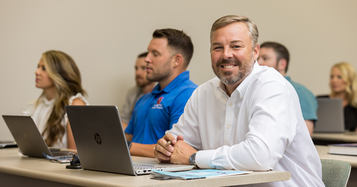 business student with laptop