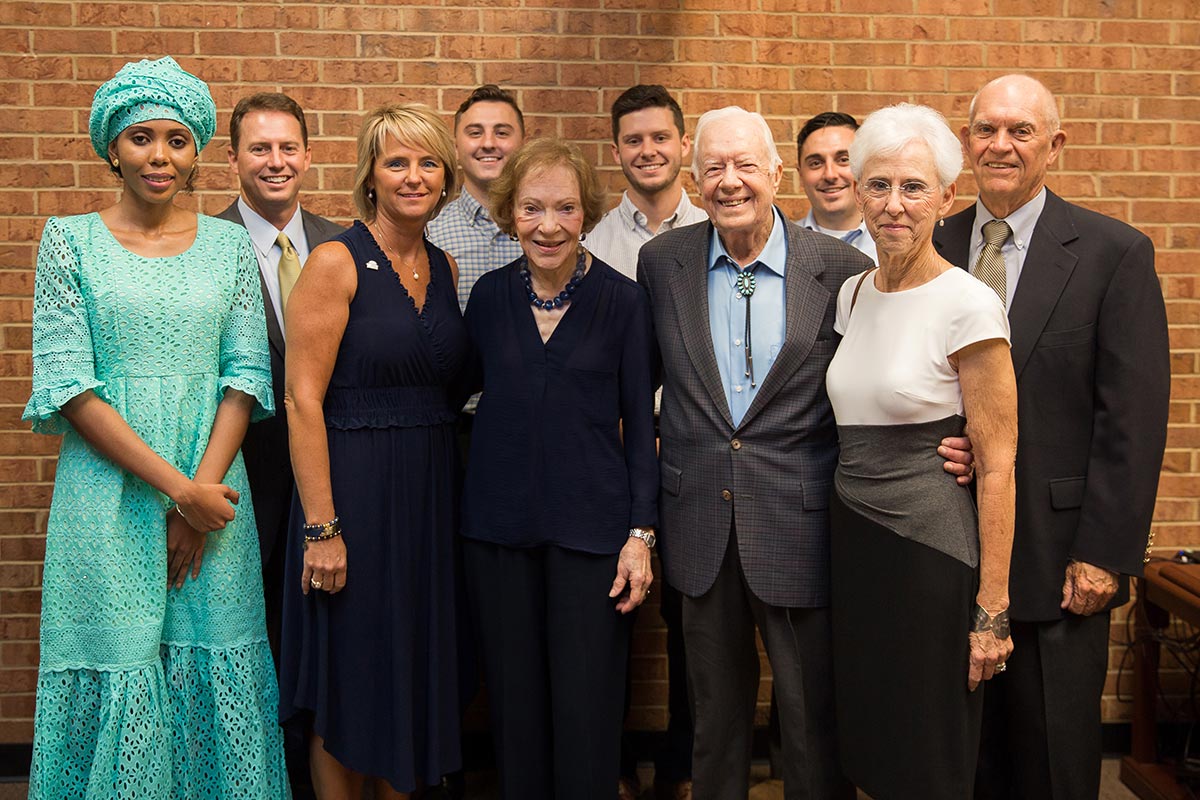 Dr. Neal Weaver (back row far left) and family meet former US President Jimmy Carter (front row fourth from left), former First Lady Rosalynn Carter (front row third from left), and human rights activist Jaha Dukureh (front row far left) - all GSW alumni - during Weaver's Presidential Investiture celebrations in October 2018.