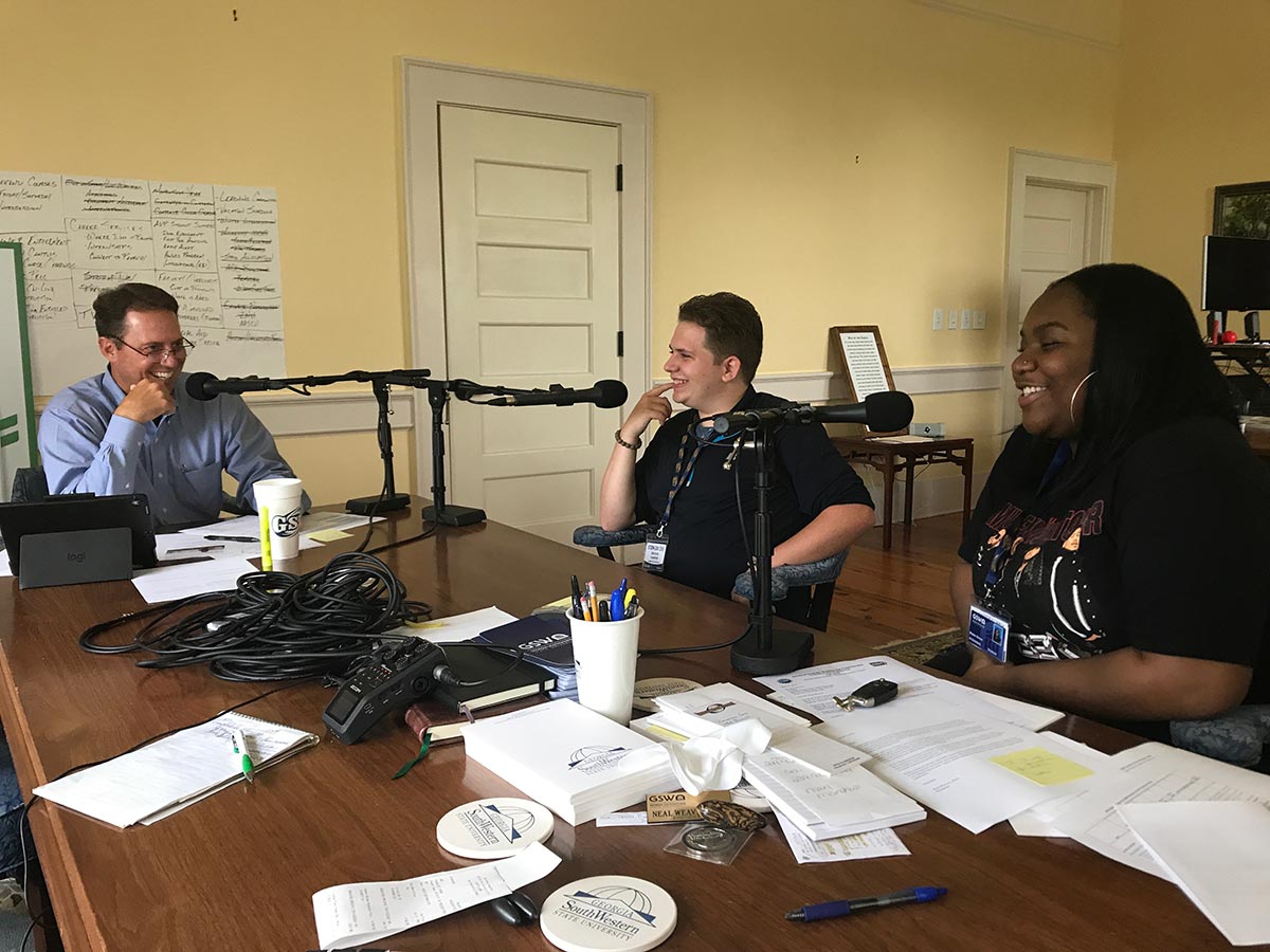 Dr. Neal Weaver interviews two students on his podcast "What's in the Cup?" in June 2019.