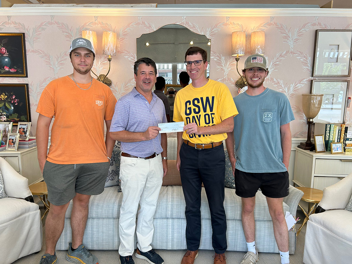 Sigma Chi receives donation from Minick Interiors