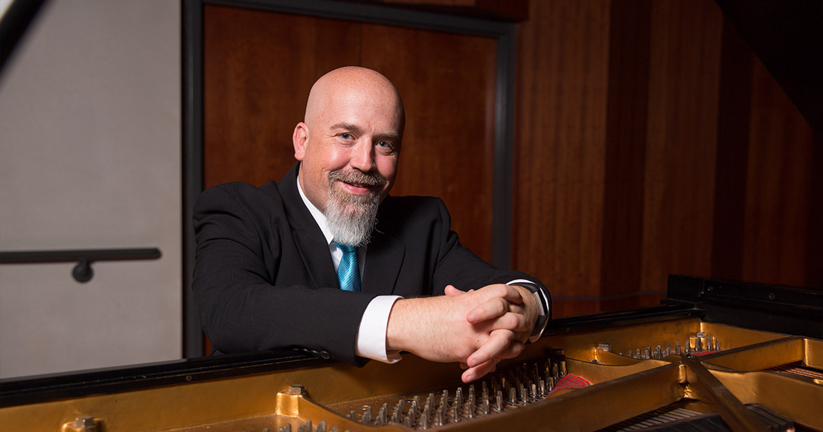 Mark Laughlin posed with piano