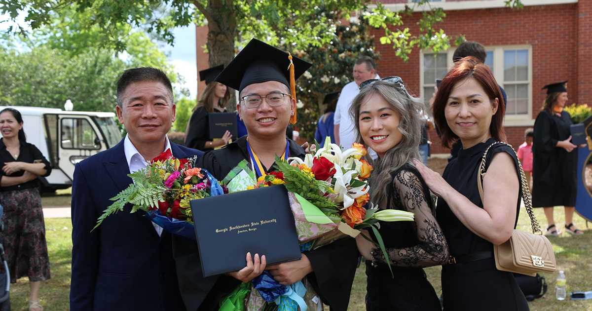 Minh Phong Diep with family at graduation
