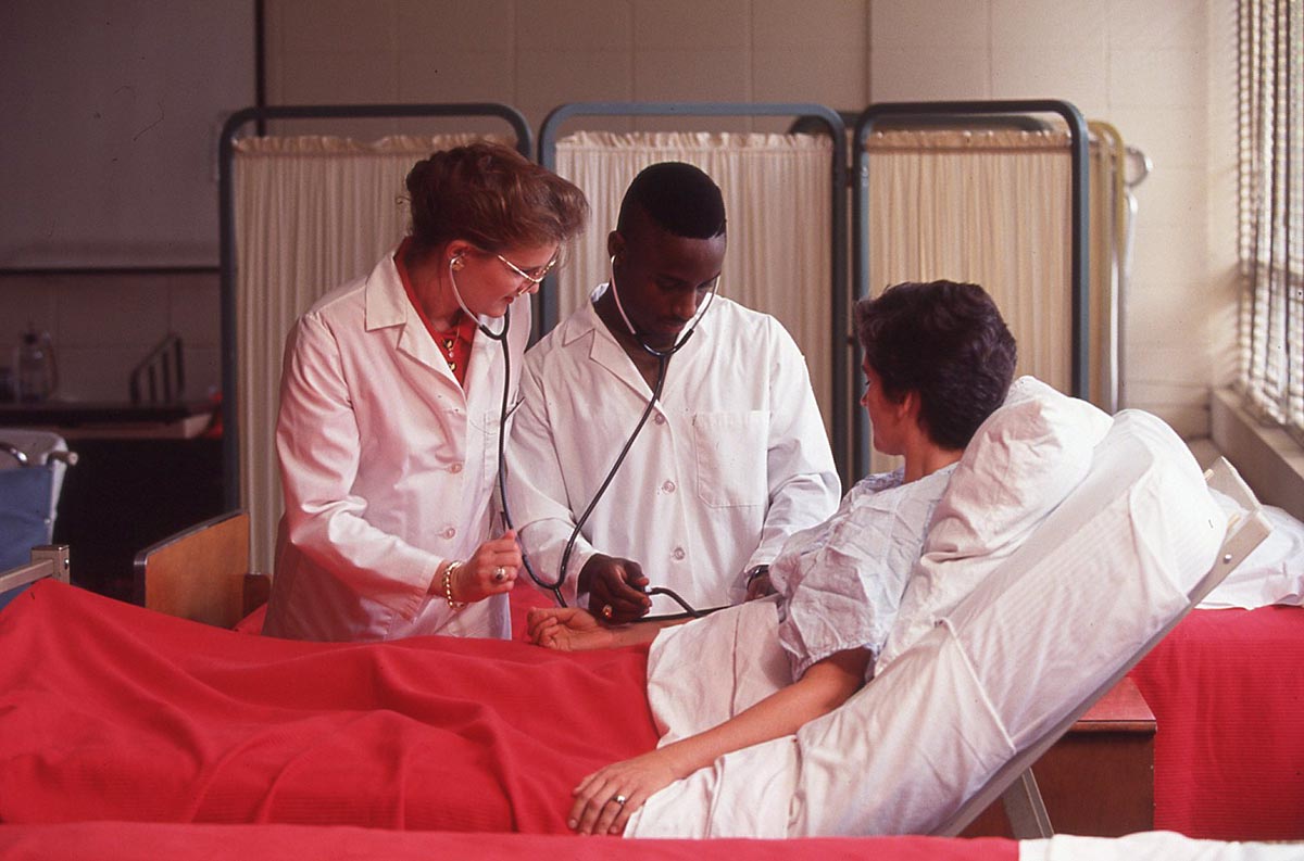 Toddy Ingram participates in a promotional photoshoot for the nursing program in the 1990s.
