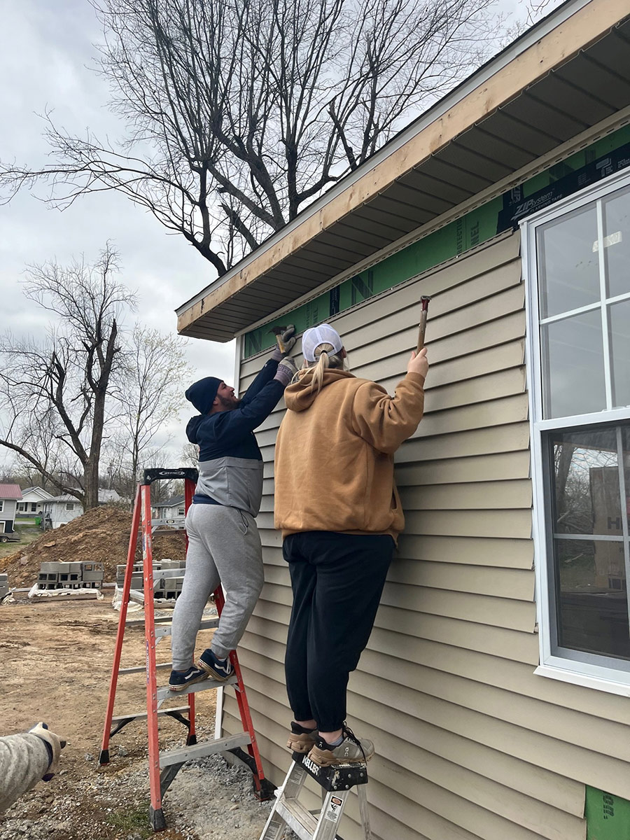 President Jimmy Carter Leadership students work on damaged homes in Kentucky.