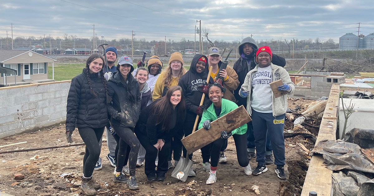 Students assist in rebuilding and cleaning up debris from recent tornado.