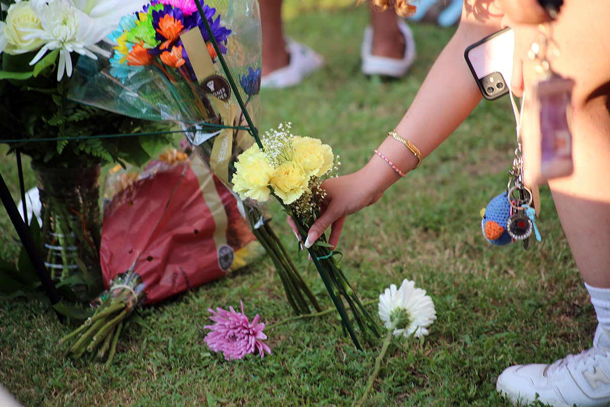 Flowers being laid at Jamal's vigil