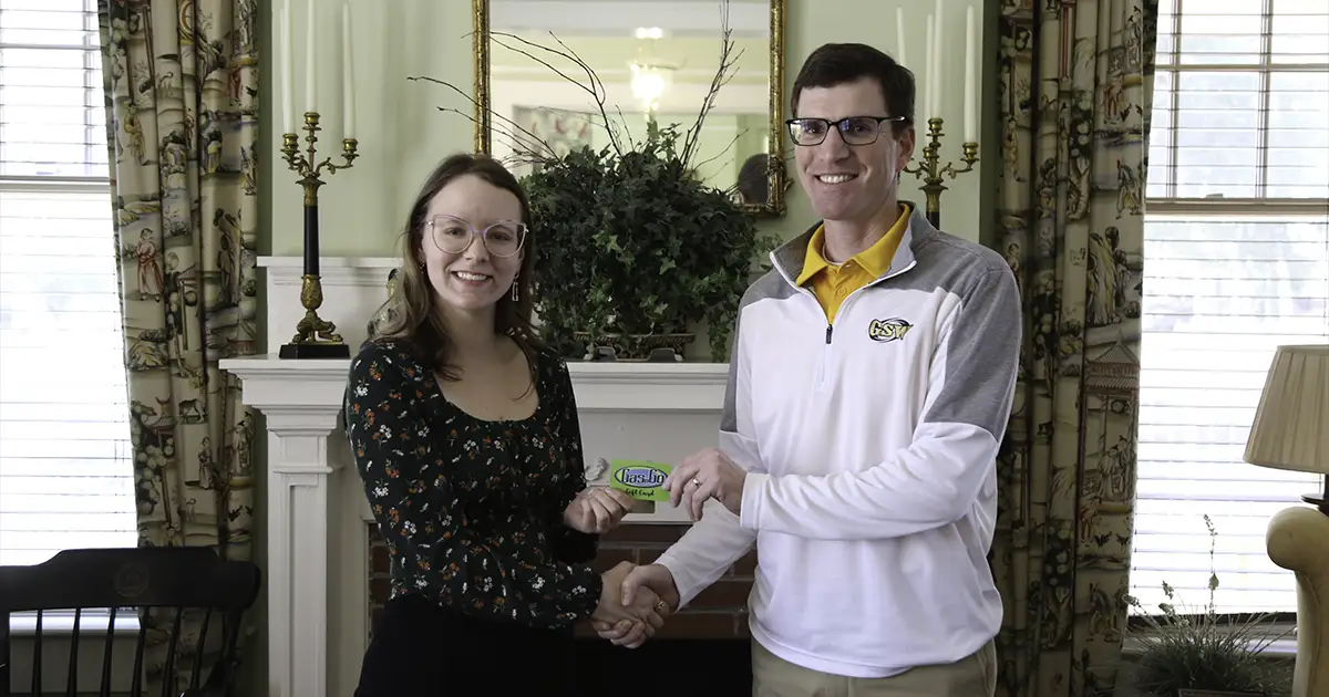 Savannah Paros accepts gas card from Stephen Snyder