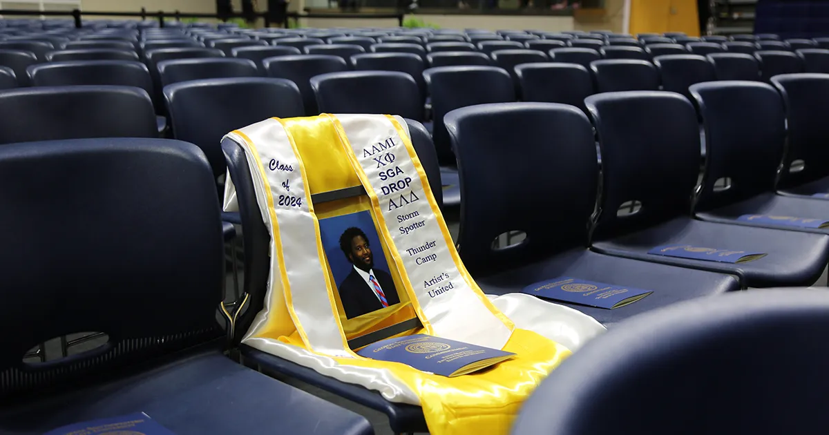 Jamal Floyd's stole and photo in his seat at graduation