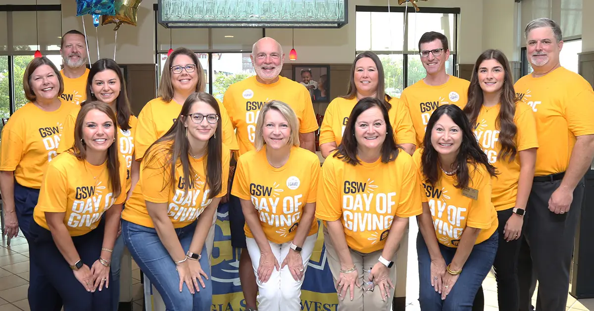 group in gold shirts