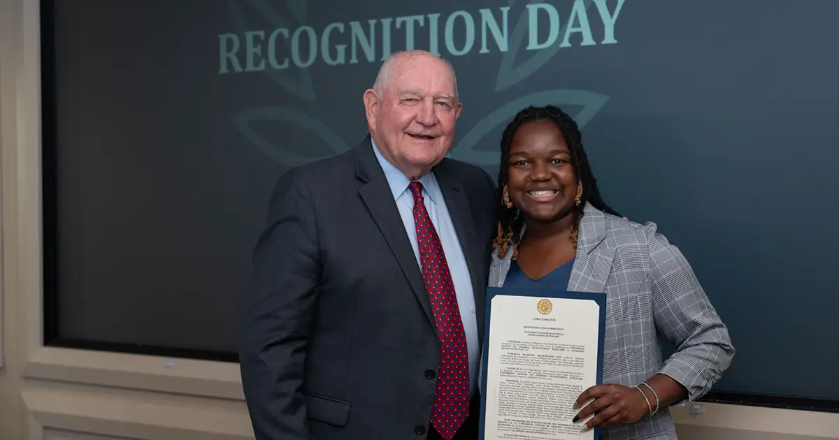 Chancellor Purdue presents Dre'a with a proclamation