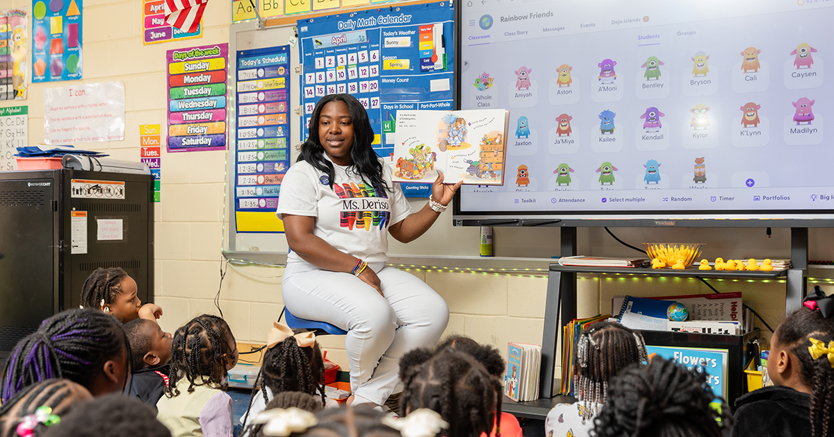 Student teacher reading to class