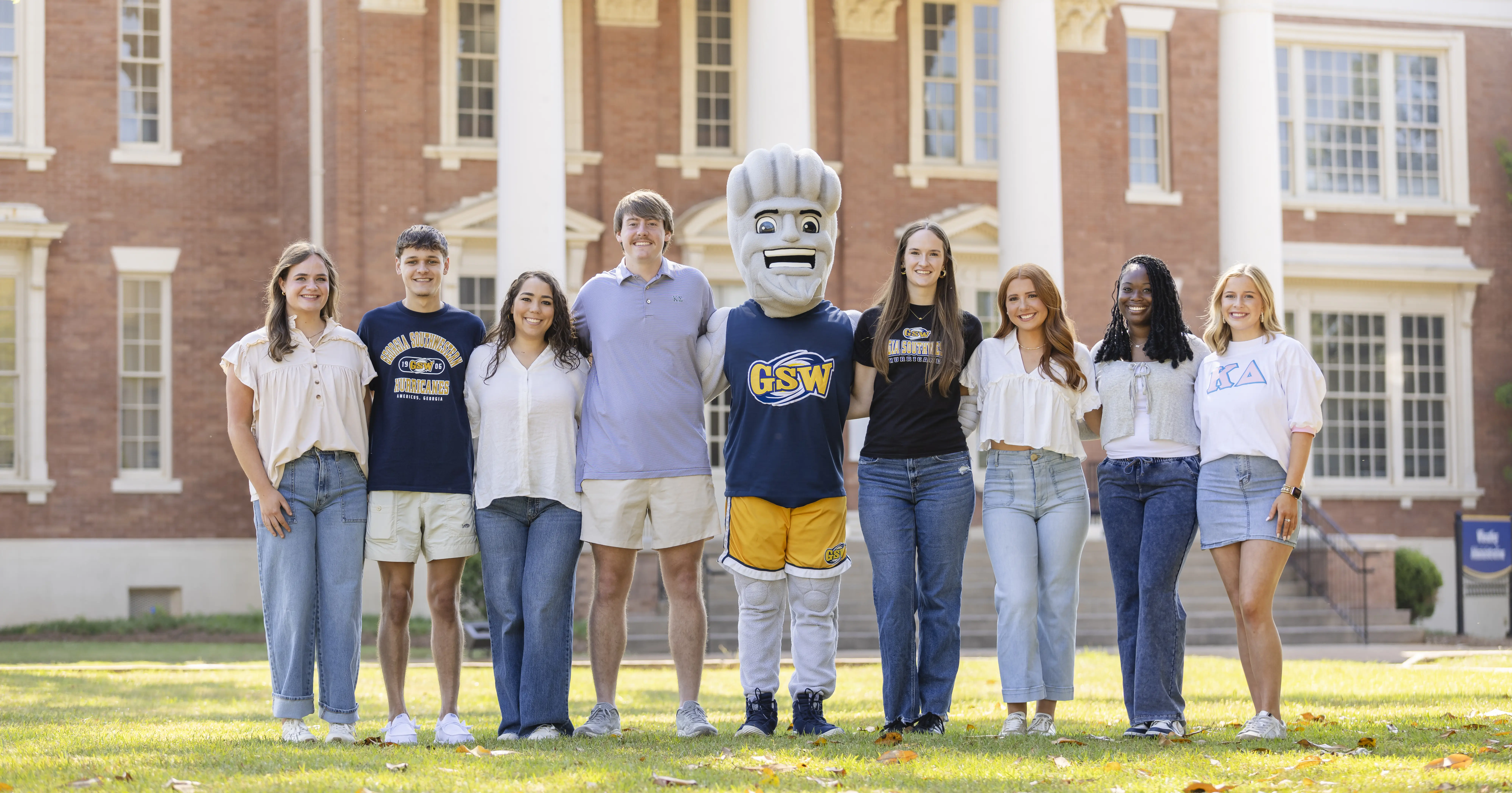 GSW students pose with Surge on the Front Lawn of the Wheatley Administration building on Georgia Southwestern State University's campus