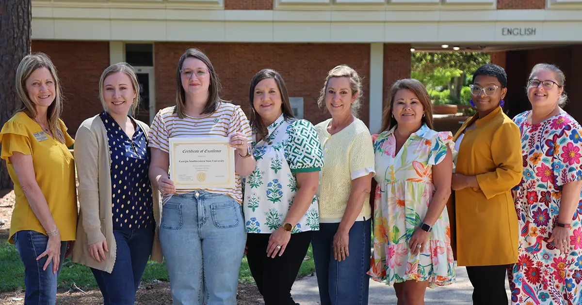 Division of Business and Finance staff members with award
