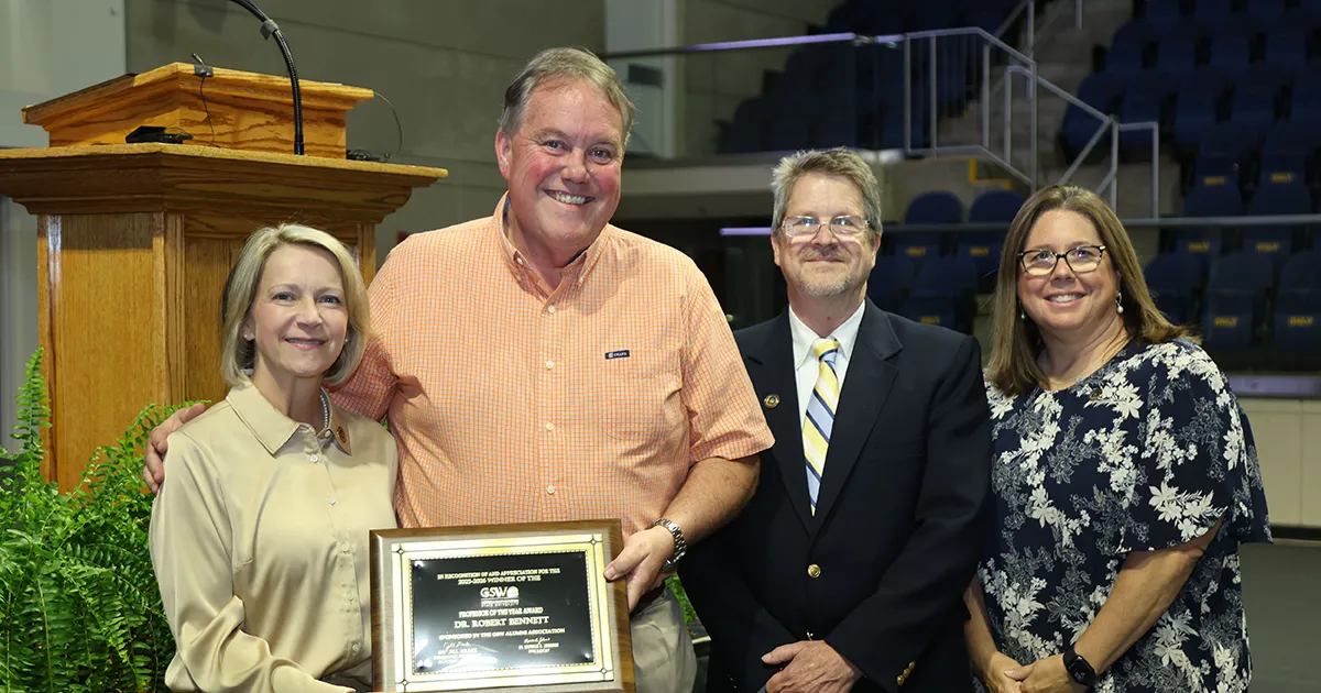 Dr. Bennett receiving Professor of the Year award