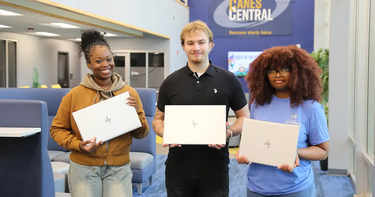 GSW students holding laptops