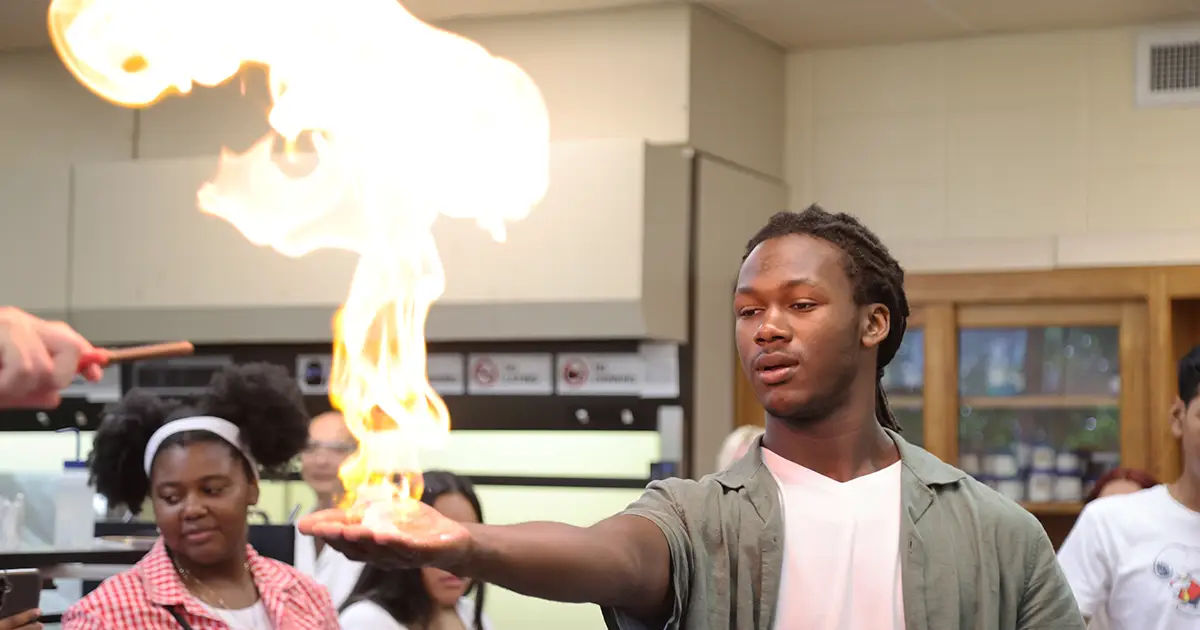 student watches fire leap off his hand during experiment