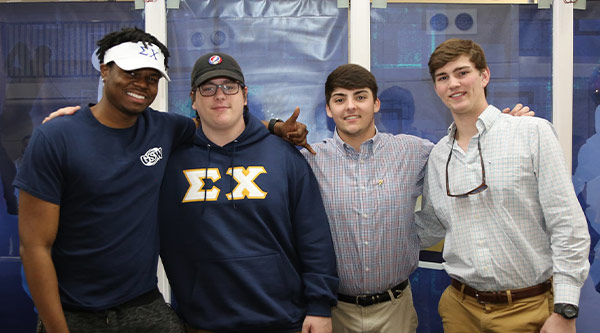 Sigma Chi Brothers at event